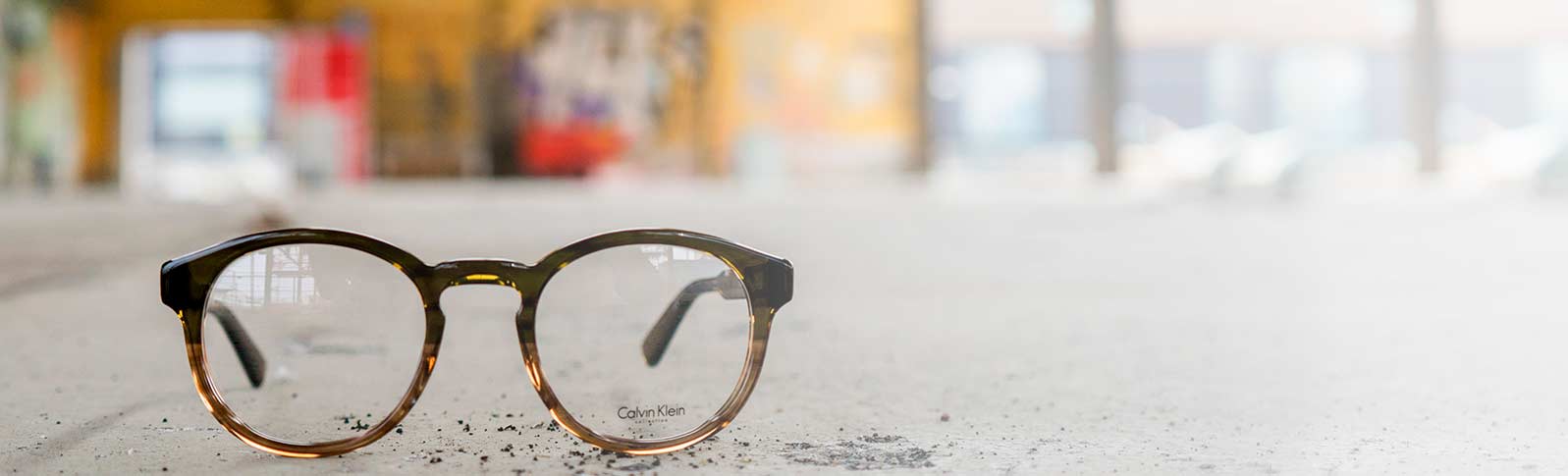glasses from calvin klein in an industrial environment