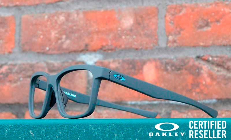 glasses on a board with a brick wall in the background