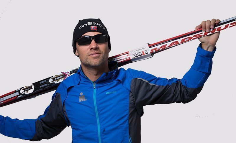 man wearing sports glasses with skis